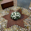 The Wreath and candle on the Holocaust Memorial.
Wreath donated by Co-operative Society