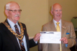 Outgoing Town Mayor, Cllr. John  Kitwood, hands over £750.00 from the proceeds of his Mayor's Appeal  to the Lincs and Notts Air Ambulance.